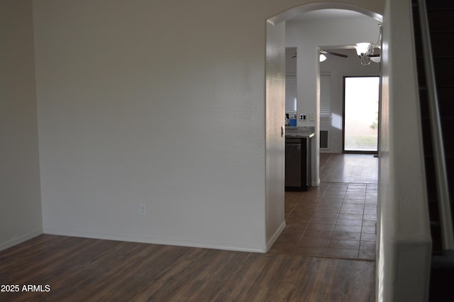 6620 W Shaw Butte Dr, Glendale, AZ 85304 - hall with arched walkways, dark wood finished floors, and baseboards