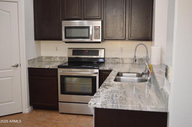 6620 W Shaw Butte Dr, Glendale, AZ 85304 - kitchen with appliances with stainless steel finishes, a sink, and dark brown cabinets