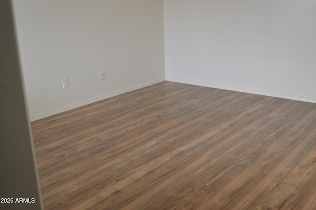 6620 W Shaw Butte Dr, Glendale, AZ 85304 - empty room featuring baseboards and dark wood finished floors