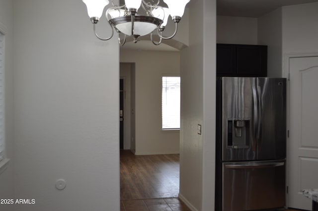 6620 W Shaw Butte Dr, Glendale, AZ 85304 - kitchen with stainless steel fridge with ice dispenser, a chandelier, baseboards, light countertops, and dark cabinets