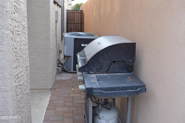 6620 W Shaw Butte Dr, Glendale, AZ 85304 - exterior view of stucco siding, central air condition unit, and a gate