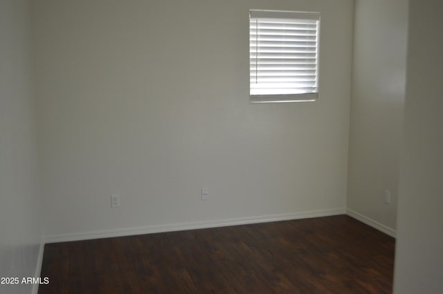 6620 W Shaw Butte Dr, Glendale, AZ 85304 - empty room with dark wood-style flooring and baseboards