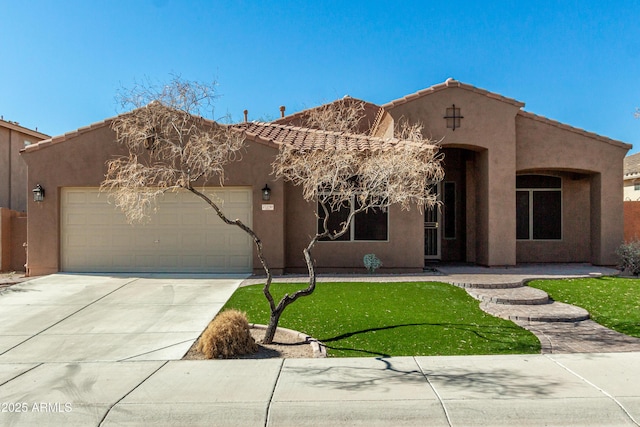 view of front of home with a garage and a front lawn