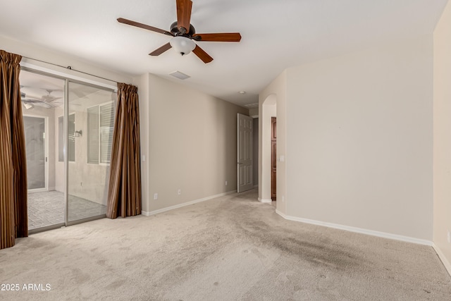 empty room with light colored carpet and ceiling fan