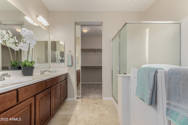 bathroom featuring vanity and an enclosed shower