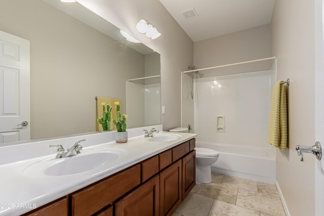 full bathroom featuring vanity, shower / bathtub combination, and toilet