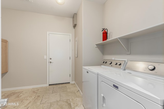 laundry area with washing machine and clothes dryer