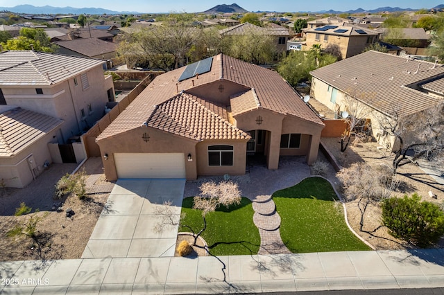 birds eye view of property featuring a mountain view