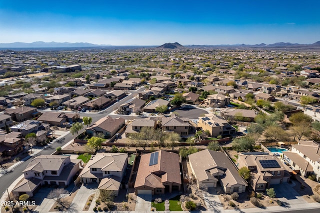 birds eye view of property featuring a mountain view