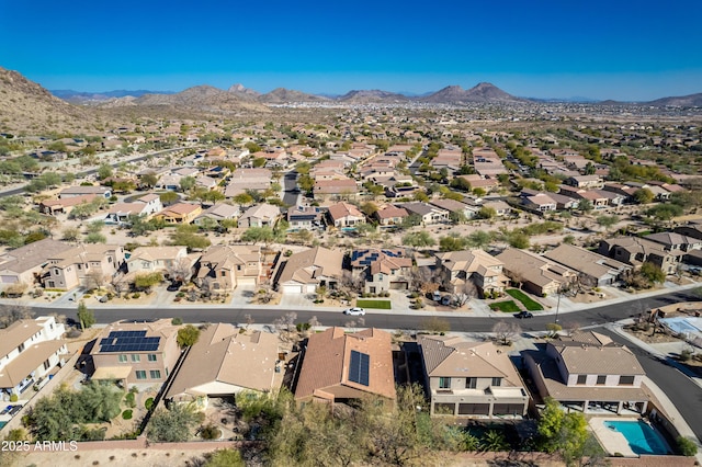 birds eye view of property featuring a mountain view