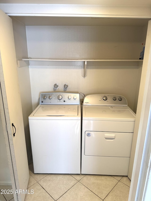 8552 E Via Del Palacio, Scottsdale, AZ 85258 - laundry room featuring light tile patterned floors, laundry area, and independent washer and dryer