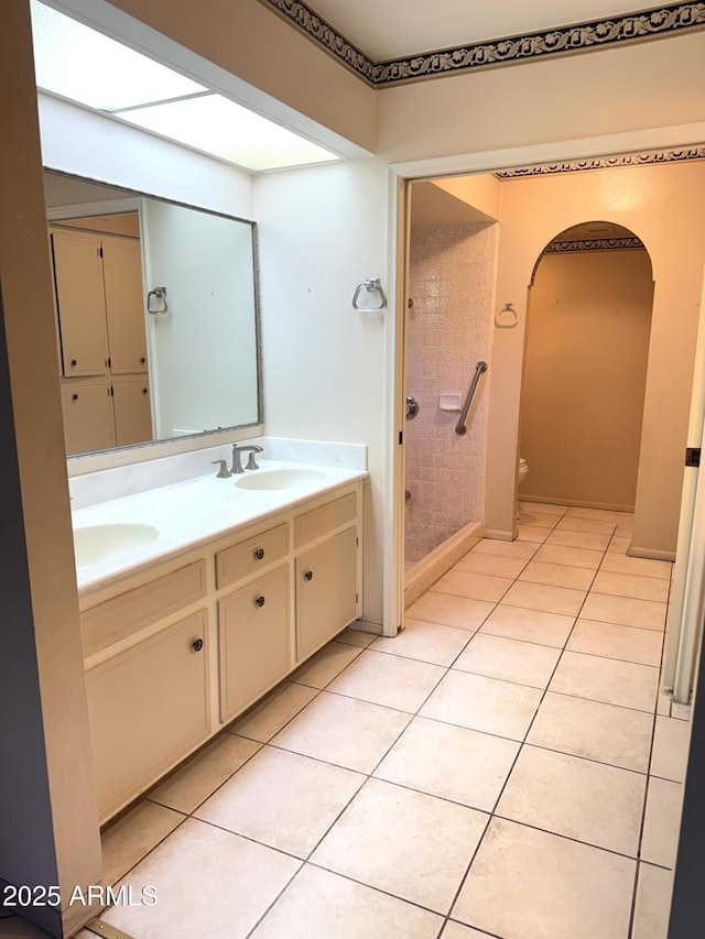 8552 E Via Del Palacio, Scottsdale, AZ 85258 - bathroom with double vanity, toilet, a sink, and tile patterned flooring