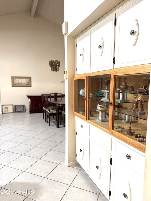 8552 E Via Del Palacio, Scottsdale, AZ 85258 - bar with vaulted ceiling with beams and light tile patterned floors
