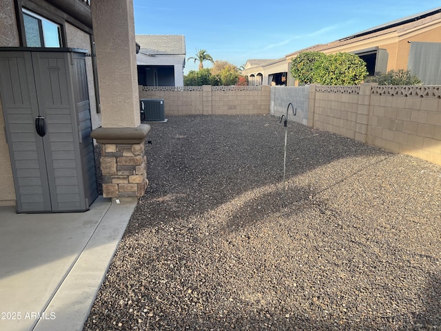 view of yard featuring a patio area and central AC unit