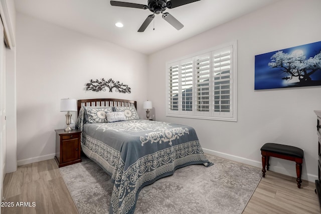 bedroom with ceiling fan and light wood-type flooring