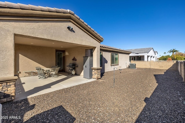 back of house featuring a patio and central air condition unit