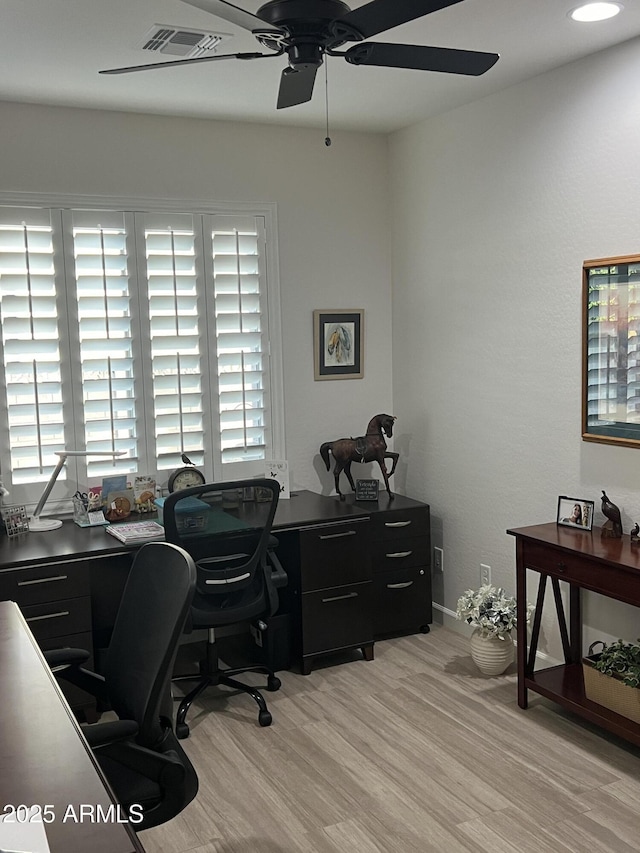 office space featuring light hardwood / wood-style floors and ceiling fan