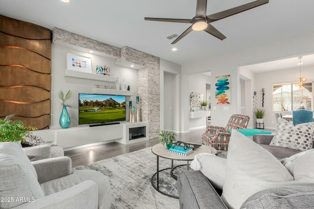 living room with hardwood / wood-style floors and ceiling fan