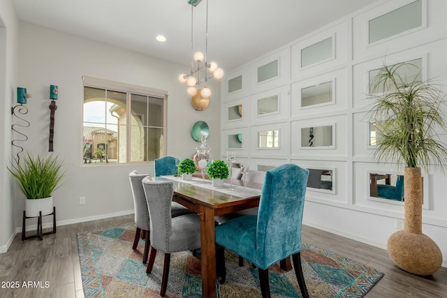 dining room with wood-type flooring