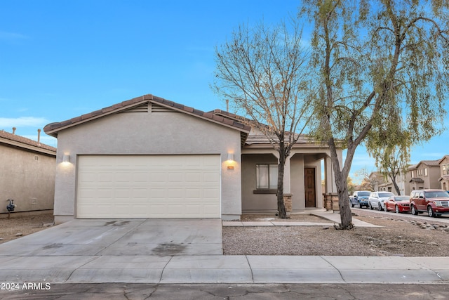 ranch-style house featuring a garage