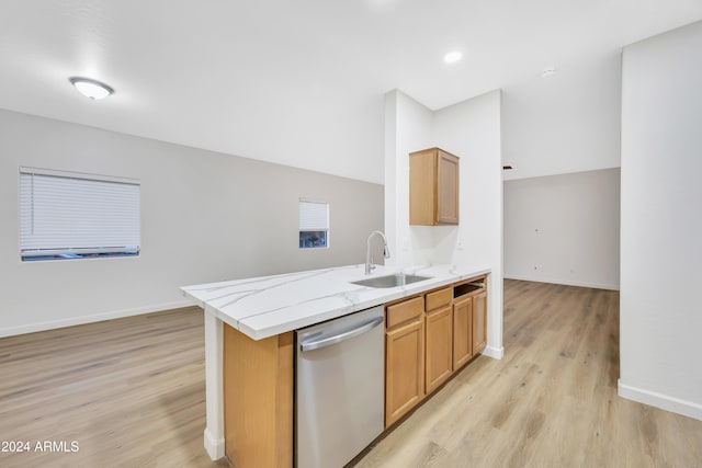 kitchen with kitchen peninsula, light hardwood / wood-style flooring, stainless steel dishwasher, and sink