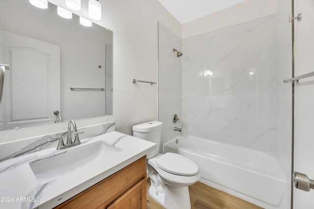 full bathroom with toilet, vanity, hardwood / wood-style flooring, and tiled shower / bath combo