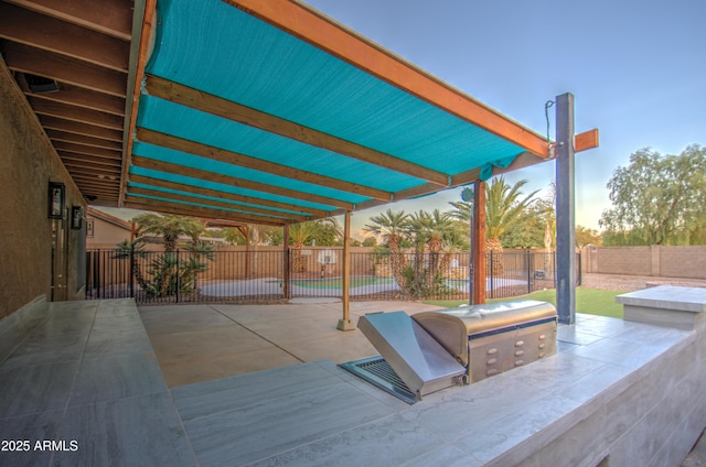 view of patio terrace at dusk