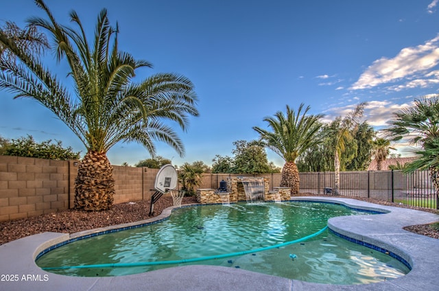 view of swimming pool with pool water feature