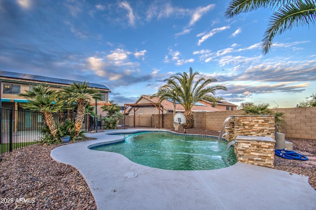 view of pool with pool water feature and a patio area