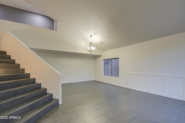 basement featuring an inviting chandelier