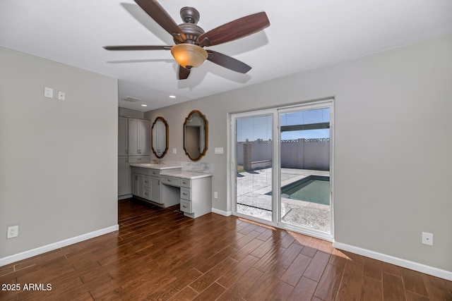 interior space with recessed lighting, dark wood-style flooring, baseboards, and a ceiling fan