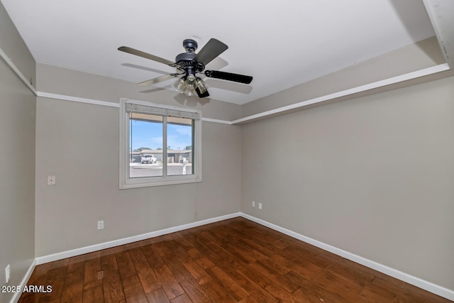 unfurnished room with wood-type flooring, baseboards, and a ceiling fan
