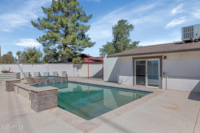 view of swimming pool with central air condition unit, a patio, a pool with connected hot tub, and fence