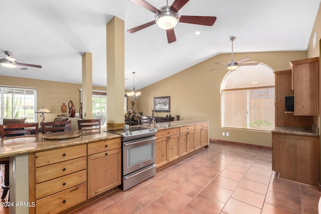 kitchen with hanging light fixtures, ceiling fan with notable chandelier, electric range, light stone countertops, and vaulted ceiling