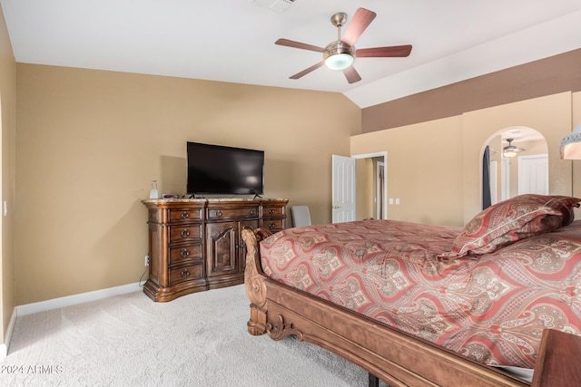 carpeted bedroom with vaulted ceiling and ceiling fan