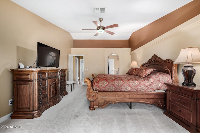 carpeted bedroom featuring lofted ceiling and ceiling fan