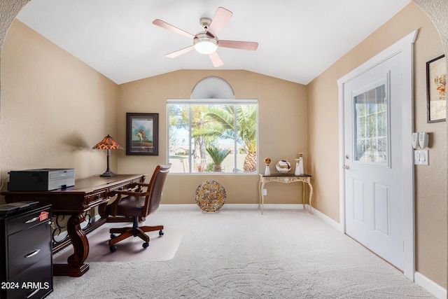 carpeted office featuring lofted ceiling and ceiling fan