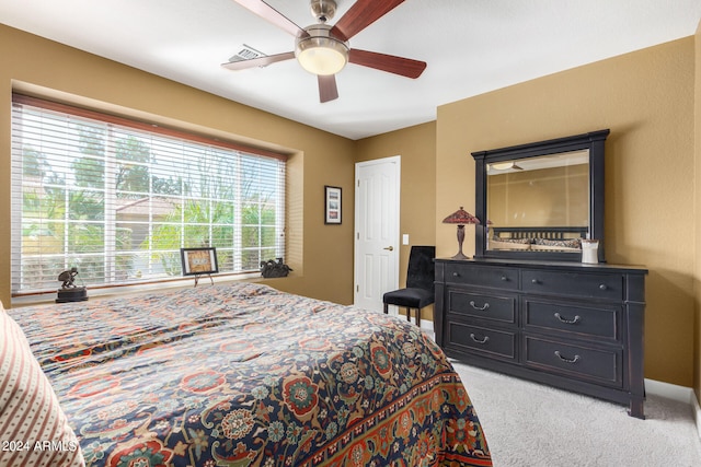 bedroom featuring ceiling fan and light colored carpet