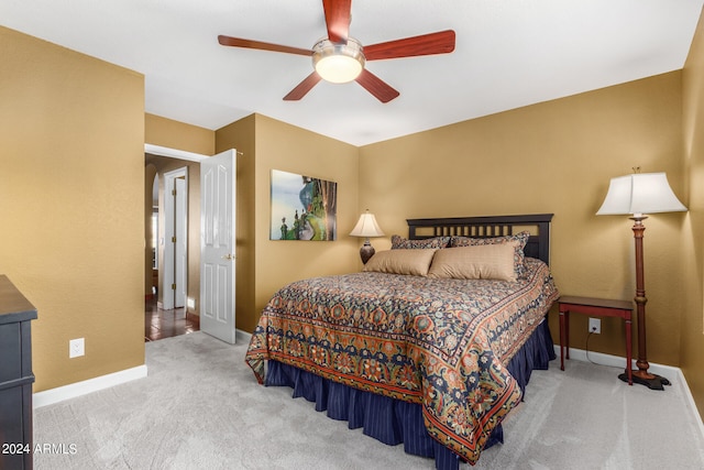 carpeted bedroom with ceiling fan