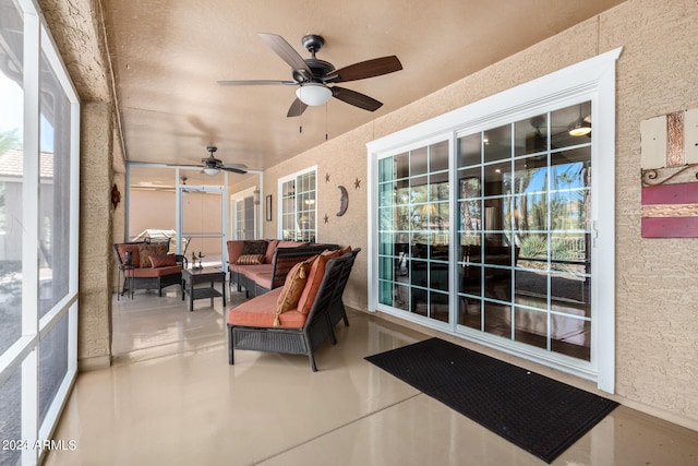 sunroom / solarium with ceiling fan