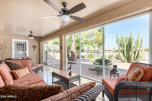 sunroom / solarium featuring ceiling fan