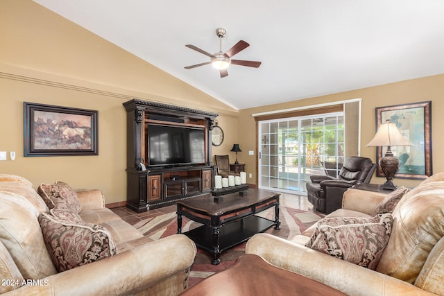 living room featuring tile patterned flooring, lofted ceiling, and ceiling fan