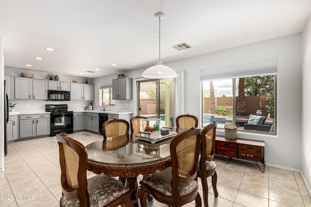 dining space featuring plenty of natural light, recessed lighting, visible vents, and light tile patterned floors