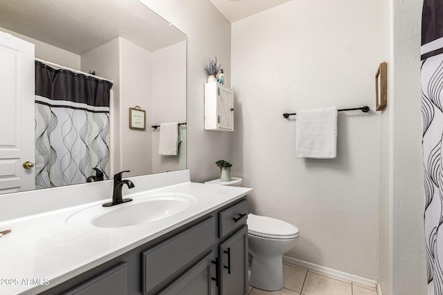 full bath with vanity, tile patterned floors, toilet, and baseboards