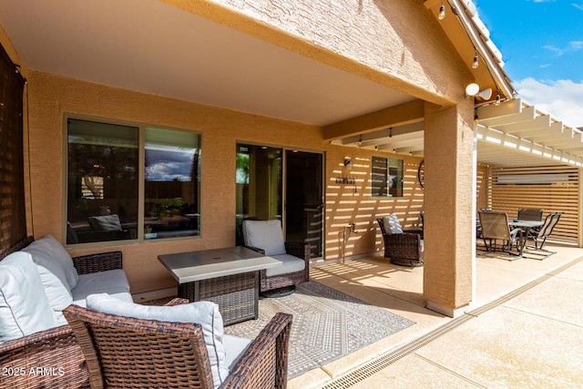 view of patio with outdoor dining space and an outdoor hangout area