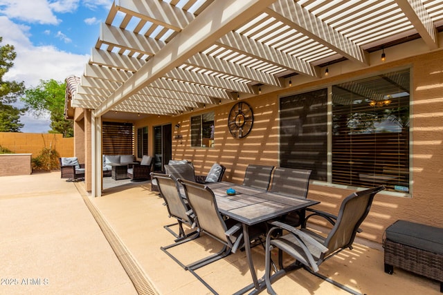 view of patio / terrace featuring outdoor dining space, fence, and an outdoor hangout area