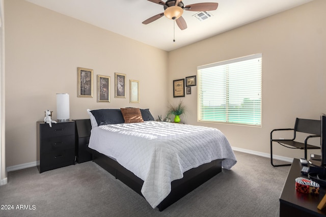 carpeted bedroom with ceiling fan