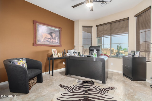 office area with ceiling fan and light tile flooring