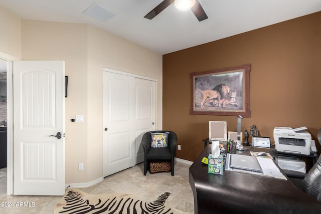 tiled office space with ceiling fan