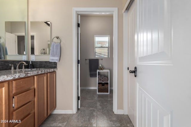 bathroom featuring oversized vanity and tile flooring